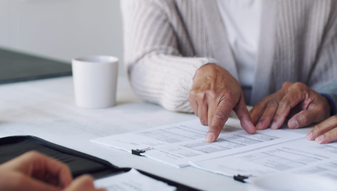 Older woman looking at documents